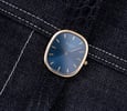 Patek Philippe Golden Ellipse ref. 3748 flat-lay on denim