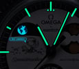 MoonSwatch Mission to Earthphase – Moonshine Gold lume shot header