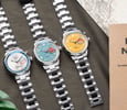 flat-lay of three Nomos Club Sport Neomatik Worldtimer models