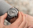 using chronograph function of Omega Speedmaster Grey Side of the Moon on wrist