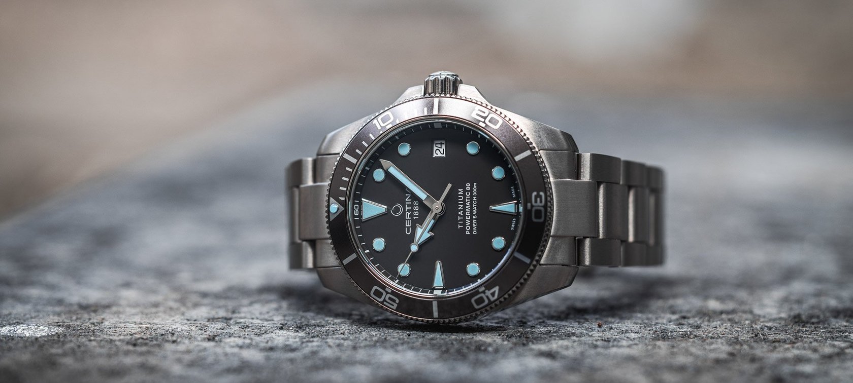 Certina DS Action Diver 38mm in titanium, crown up on rock