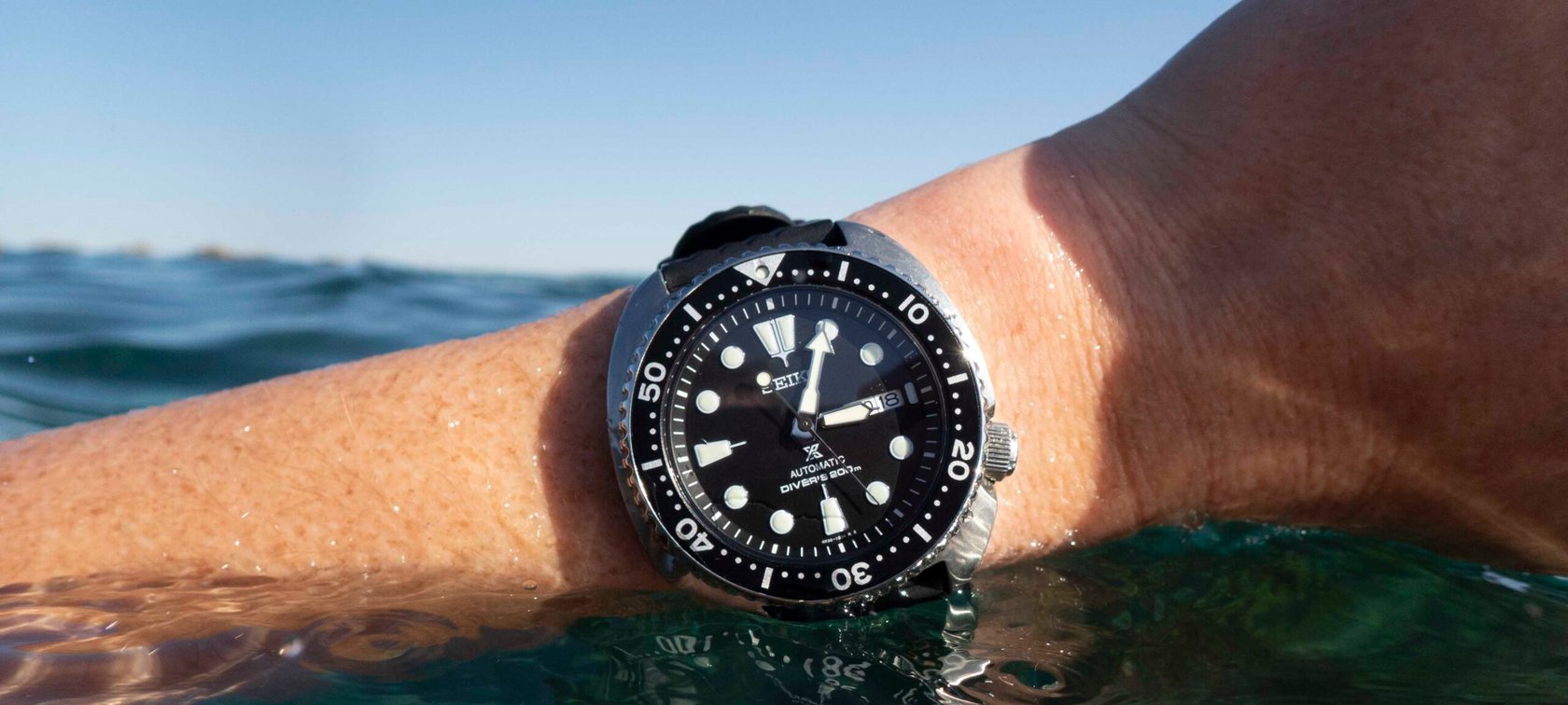 Seiko Turtle SRPE93 on wrist in water
