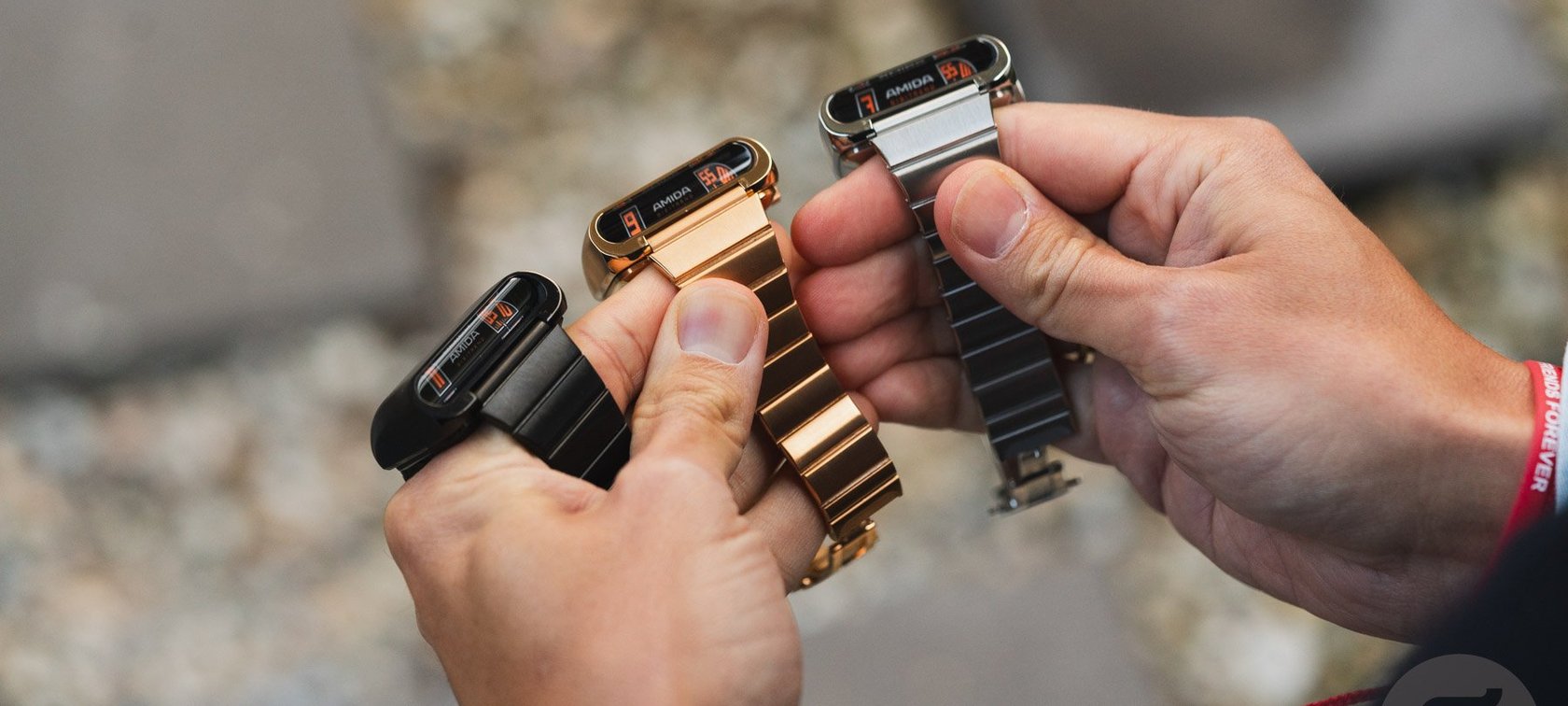 Amida Digitrend in black, gold, and steel