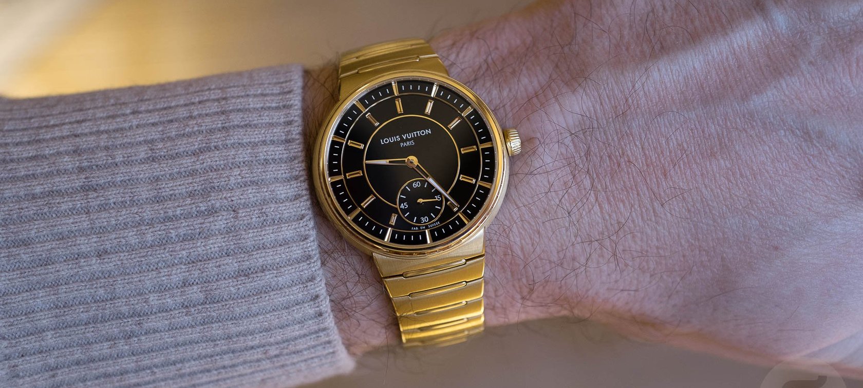Louis Vuitton Tambour Yellow Gold Onyx wrist shot header image