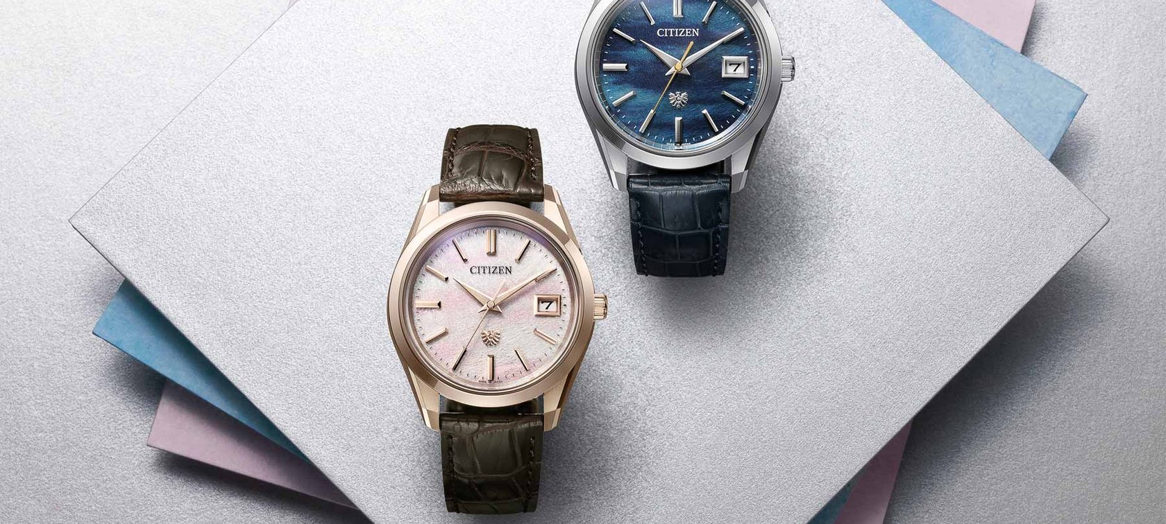 The Citizen Limited-Edition 30th Anniversary AQ4100-22L (Platinum) and AQ4106-00A (Sakura Pink)
