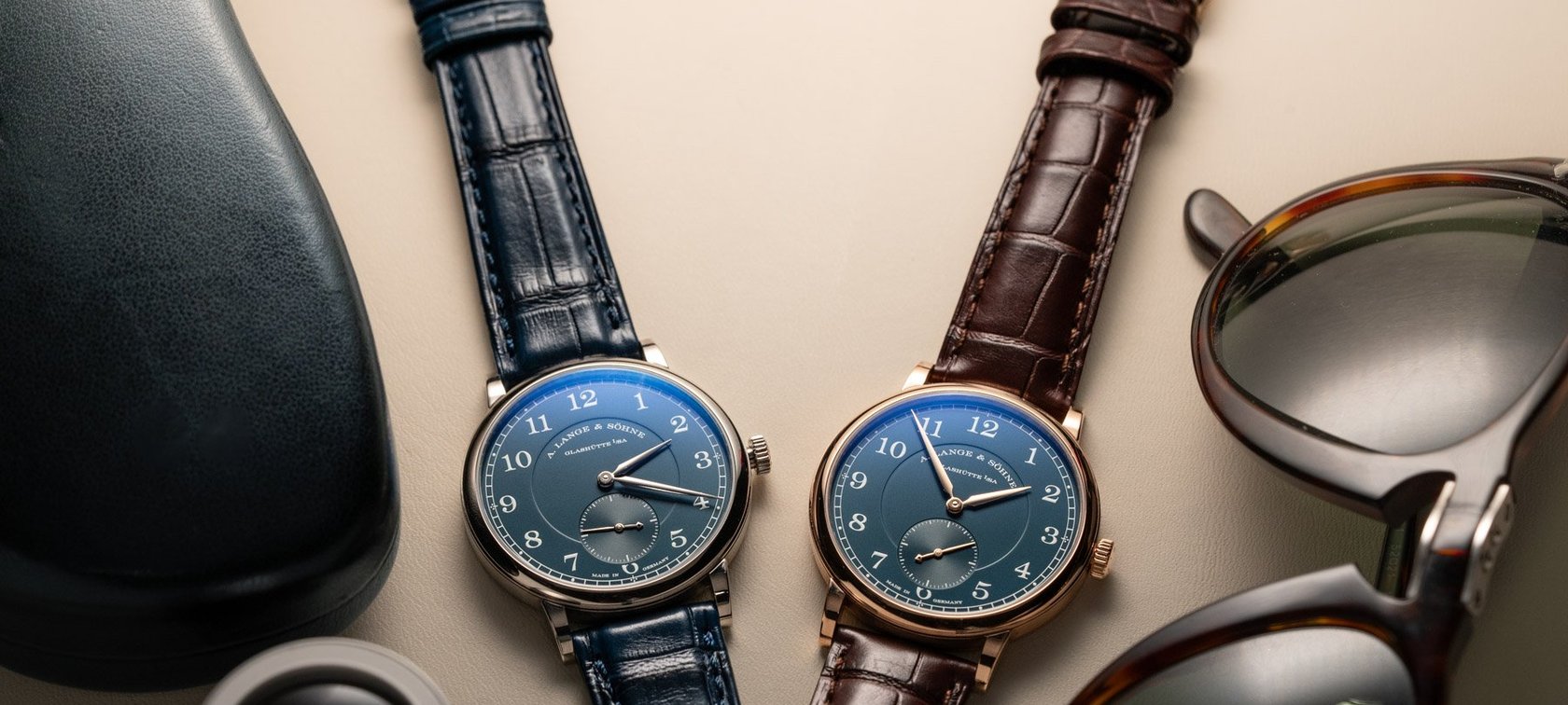 34mm white and pink gold A. Lange & Söhne 1815 flat-lay with sunglasses and loupe