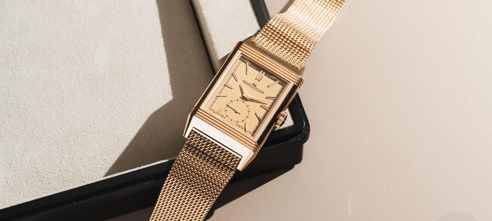 Watches and Wonders 2025 — pink gold Jaeger-LeCoultre Reverso Tribute Monoface Small Seconds with Milanese bracelet on edge of tray