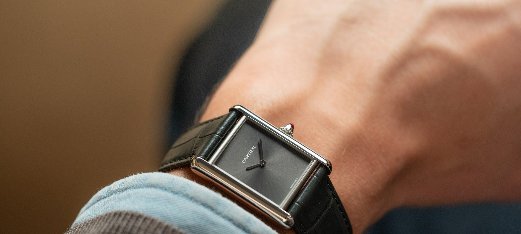 platinum Cartier Tank Must dress watch on wrist