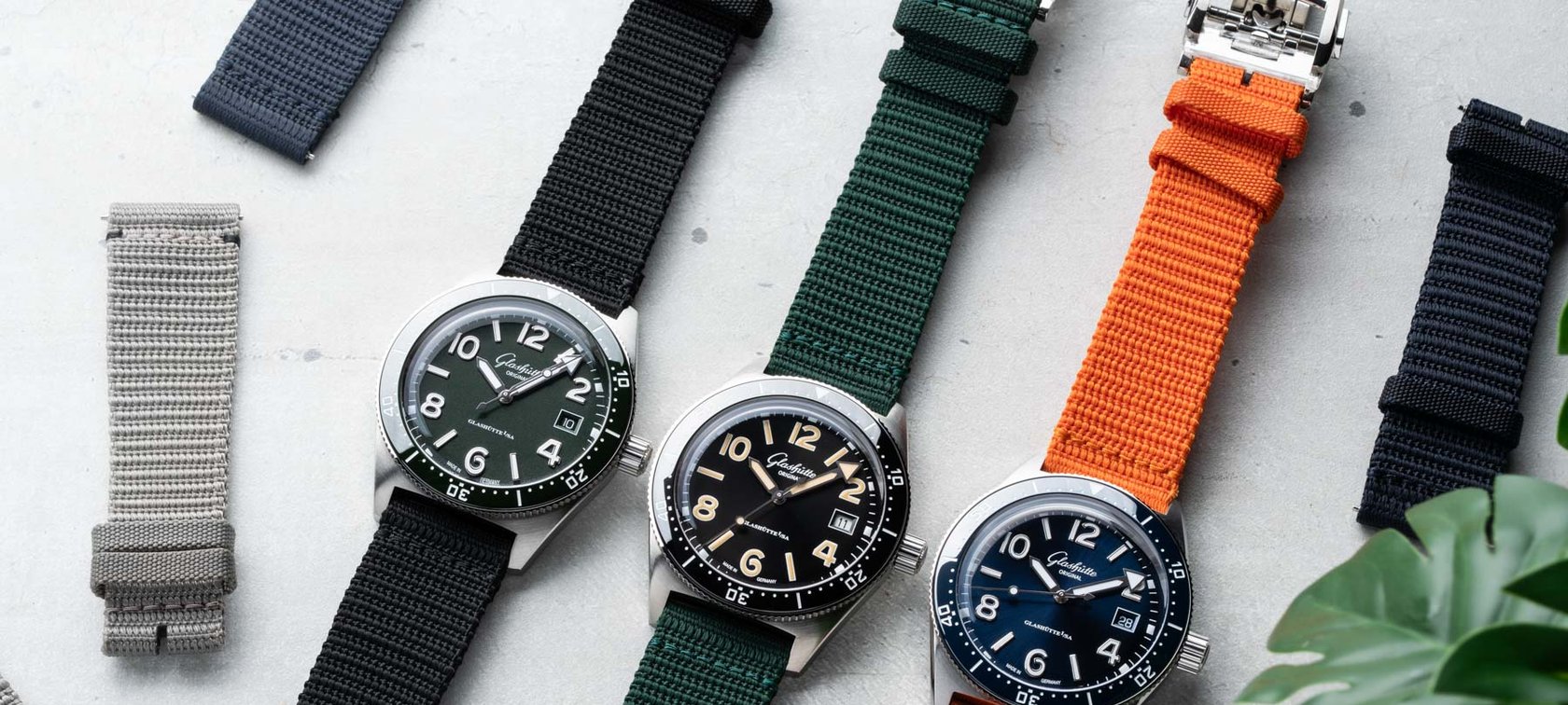 39.5mm Glashütte Original SeaQ models with five textile straps, flat-lay
