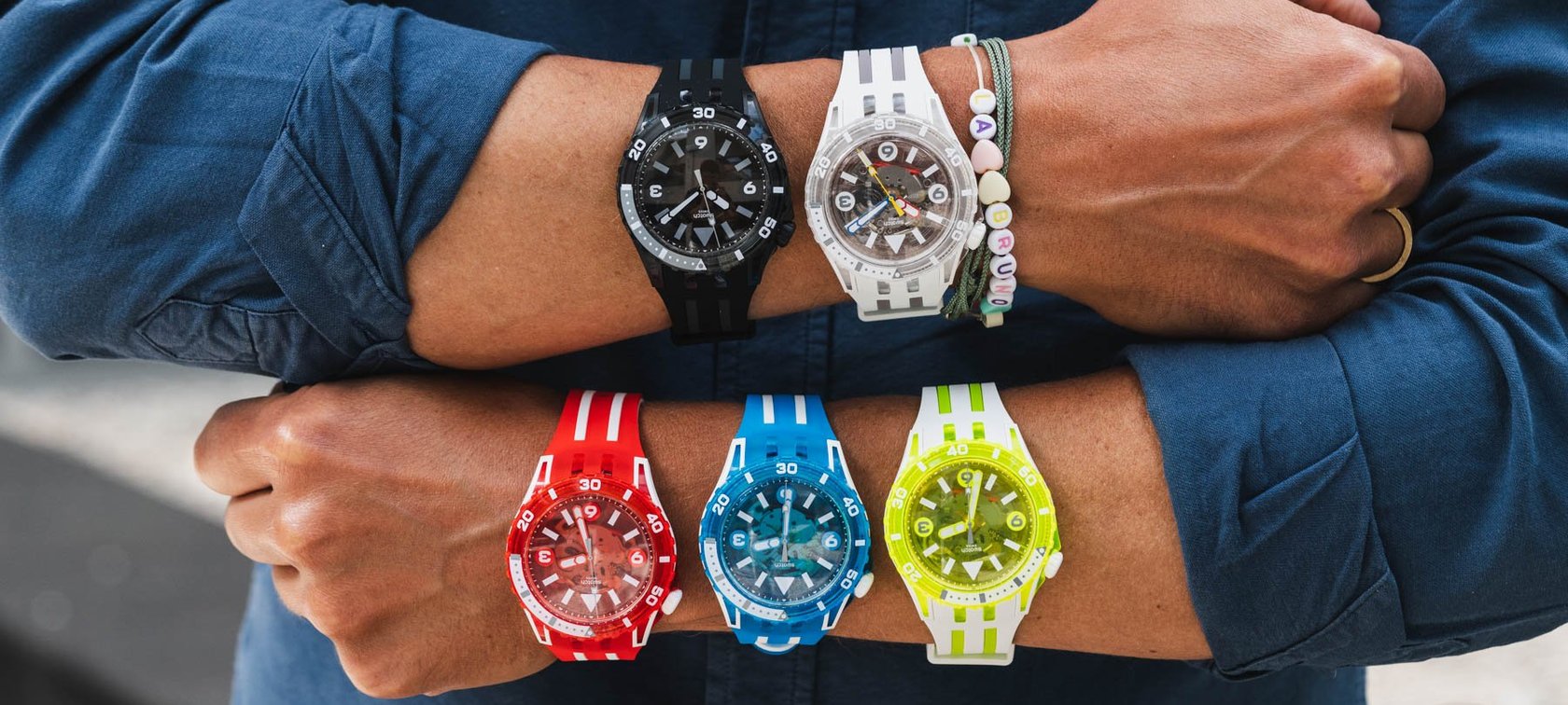 full lineup of Swatch ScubAqua models on wrists