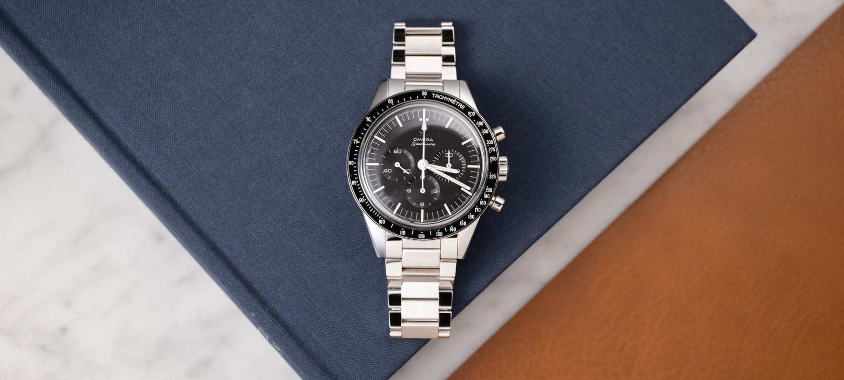 Omega Speedmaster Calibre 321 flat-lay on book