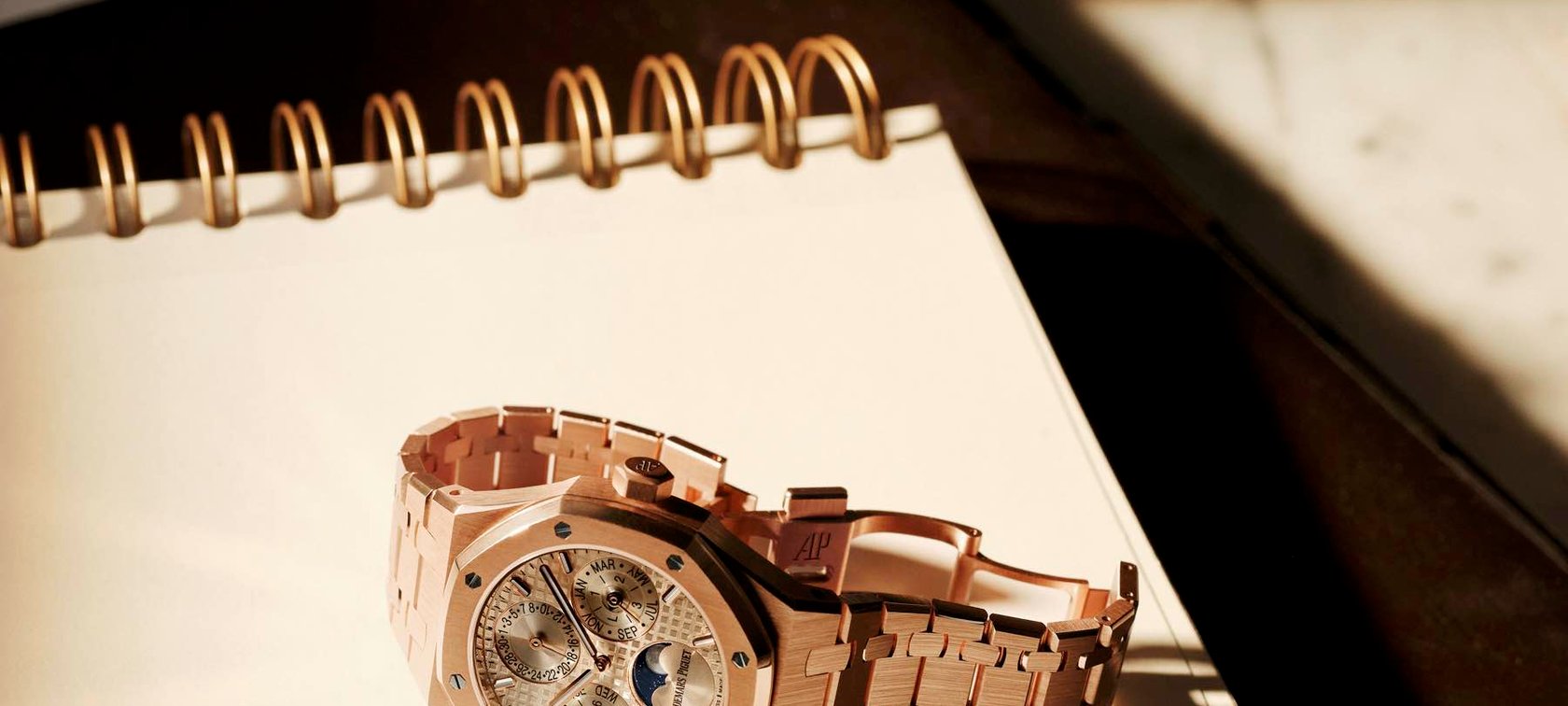 38mm pink gold Audemars Piguet Royal Oak Selfwinding Perpetual Calendar, crown up on notebook