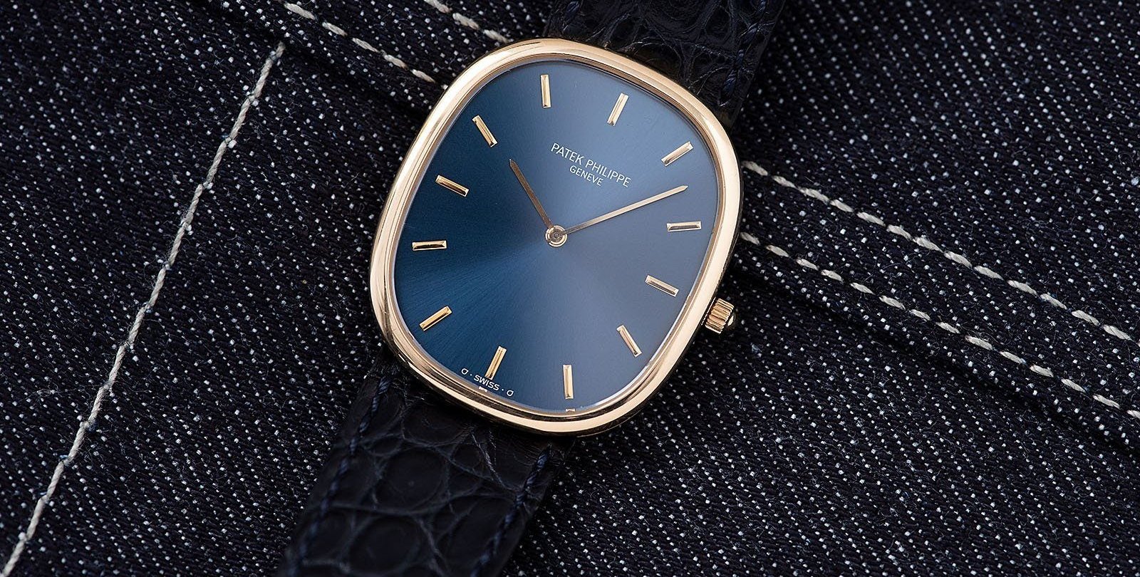 Patek Philippe Golden Ellipse ref. 3748 flat-lay on denim