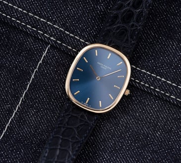 Patek Philippe Golden Ellipse ref. 3748 flat-lay on denim
