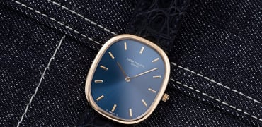 Patek Philippe Golden Ellipse ref. 3748 flat-lay on denim