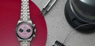 watches with colorful dials — Tudor Black Bay Chrono pink dial flat-lay header image