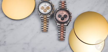 steel-and-gold Omega Speedmaster Professional models side by side