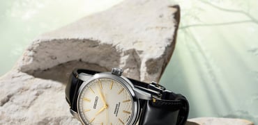 Seiko Presage Classic Series Craftsmanship Unglazed Arita Porcelain Dial Limited Edition SPB497 on rock, crown up