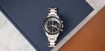 Omega Speedmaster Calibre 321 flat-lay on book