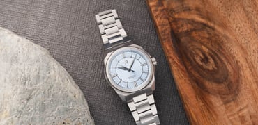 RZE Resolute 36 Halcyon flat-lay between a stone and wood