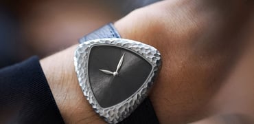 Anoma A1 Prehistoric on wrist, over-shoulder shot