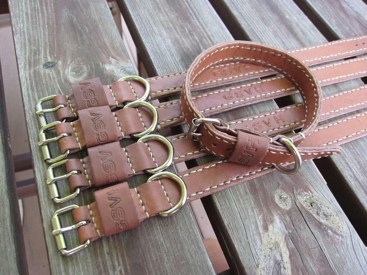 A special order of cowhide dog collars - these dogs are well taken care of!