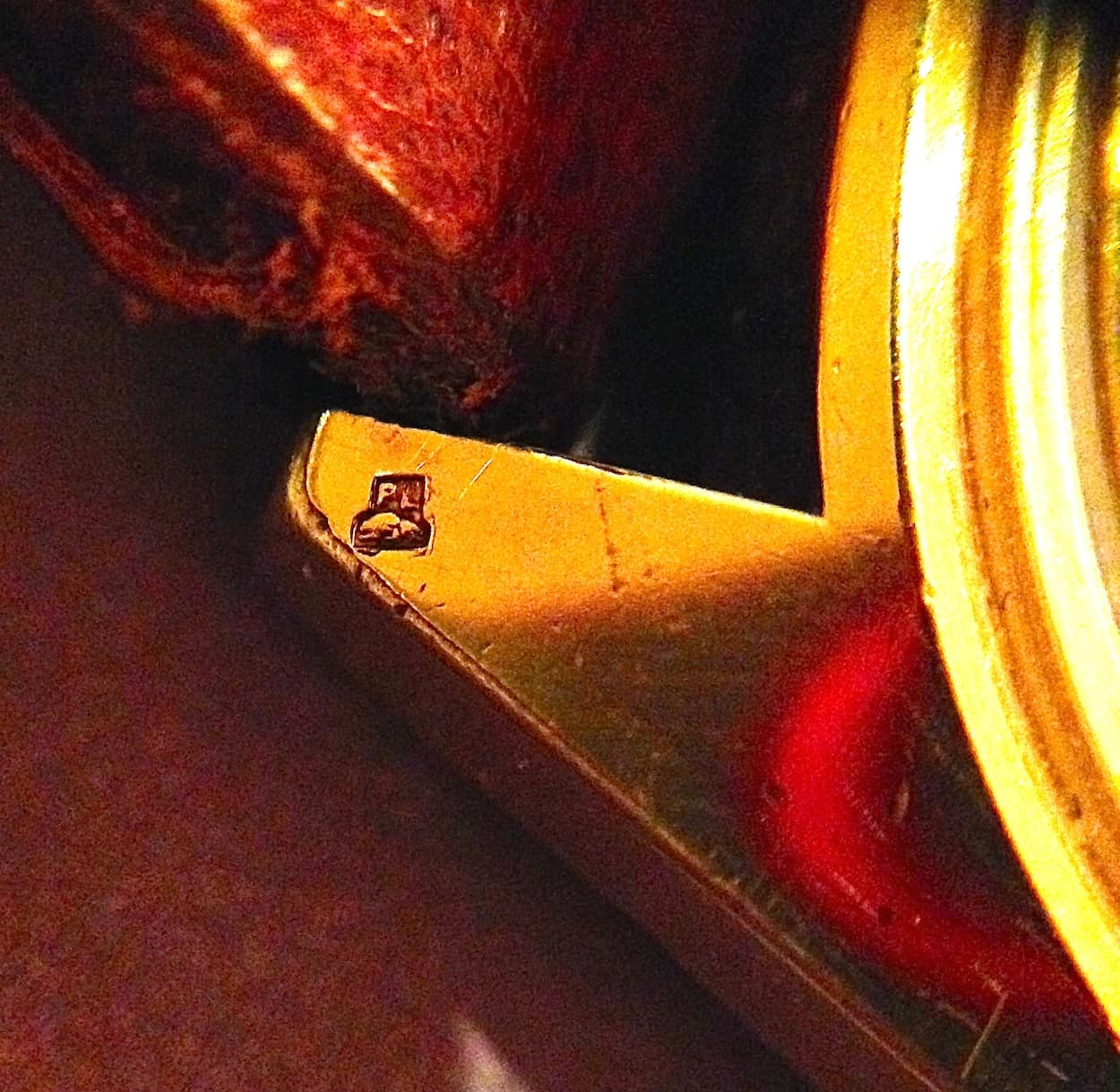 The odd Portuguese hallmark showing "PL" and everyone's favorite animal, the cockroach.