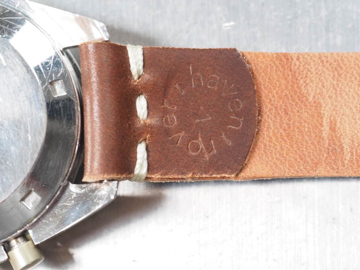 The backside of a saddle stitched strap from Rover Haven with the brand's logo