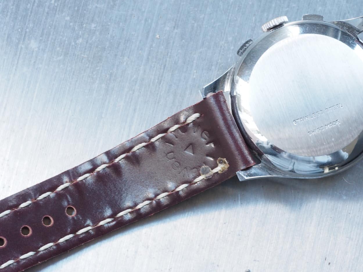 The back side of a Rover Haven Arts & Crafts strap showing the logo of the company