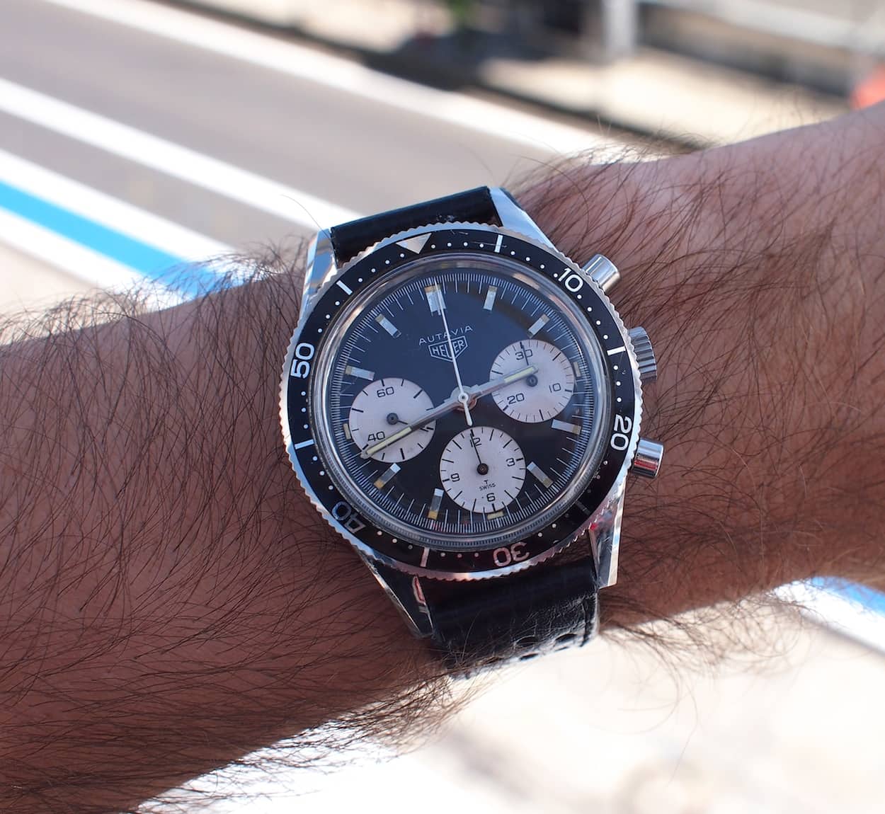 Heuer Autavia 2446 on the wrist at the track