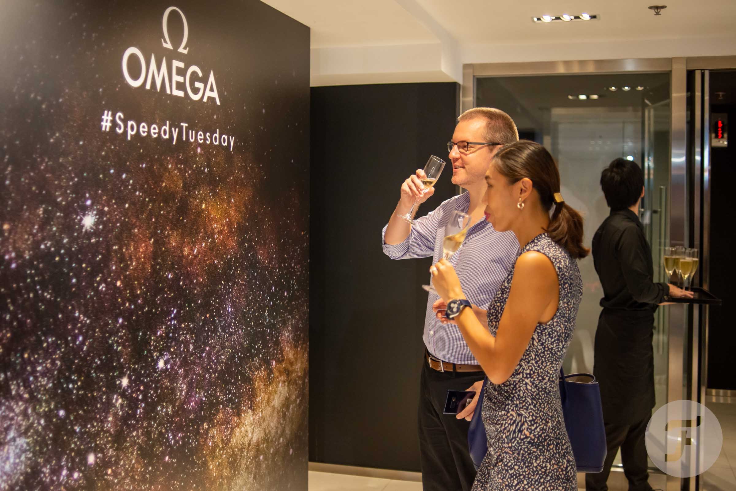 man and woman drinking champagne at 2019 Hong Kong Speedy Tuesday event
