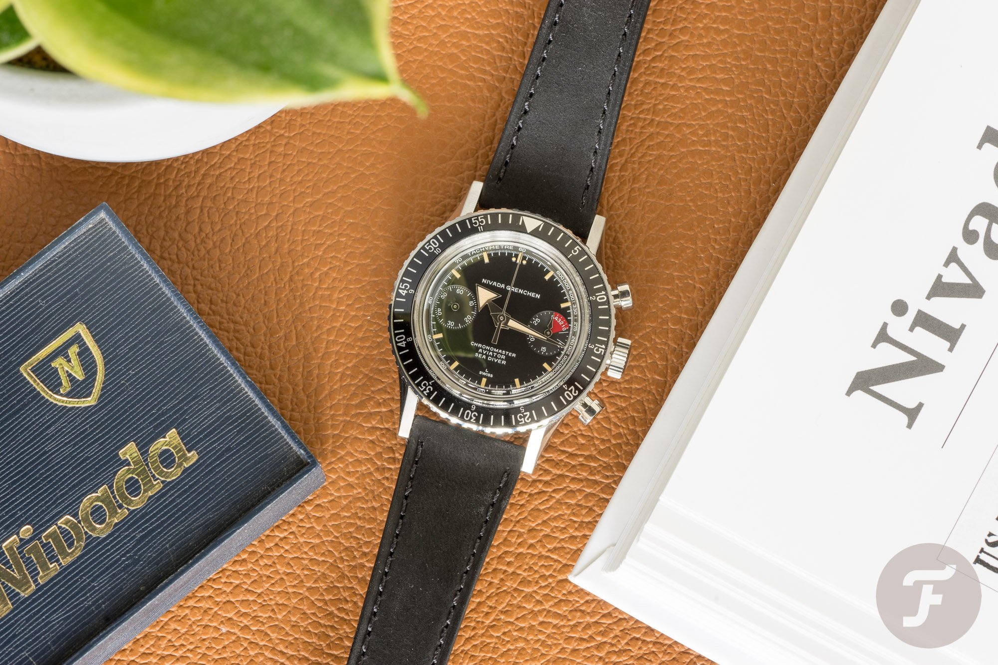 Nivada Grenchen Chronomaster Broad Arrow flat-lay