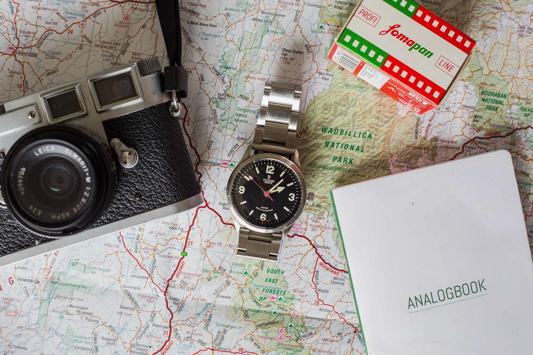 Tudor Heritage Ranger on map with camera, film, and log book