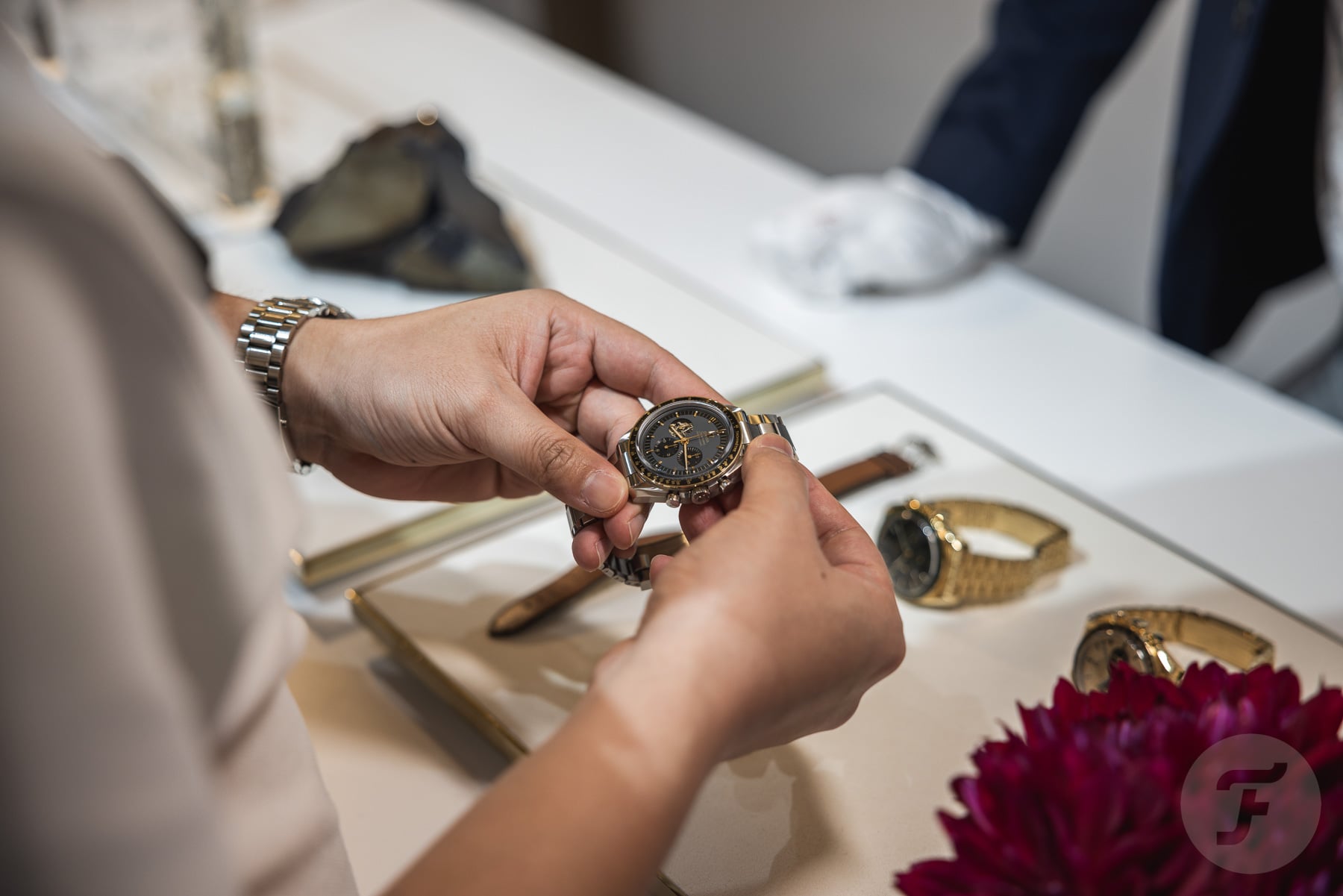 man holding an Omega Speedmaster Apollo 11 50th Anniversary model at 2023 Tokyo Speedy Tuesday event