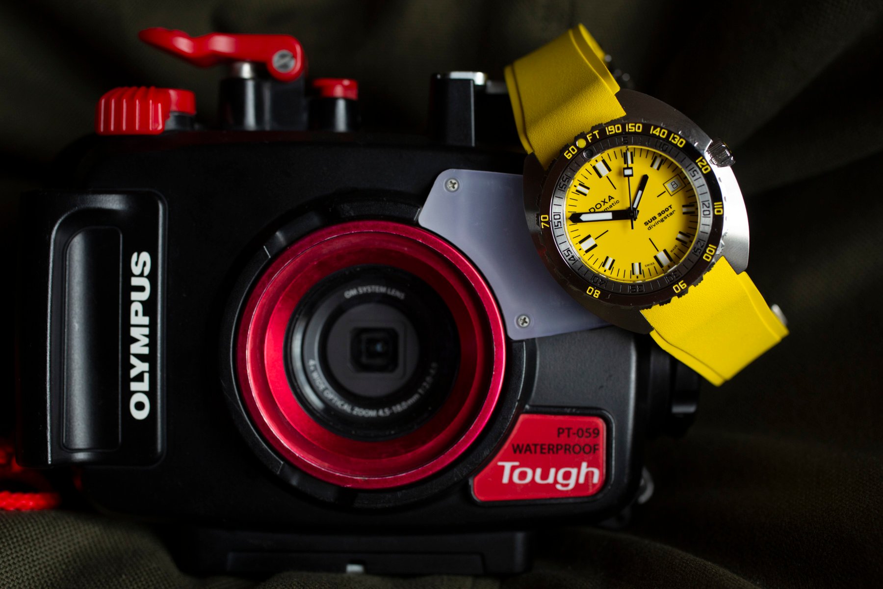 Doxa Sub 300T Divingstar hanging off of camera