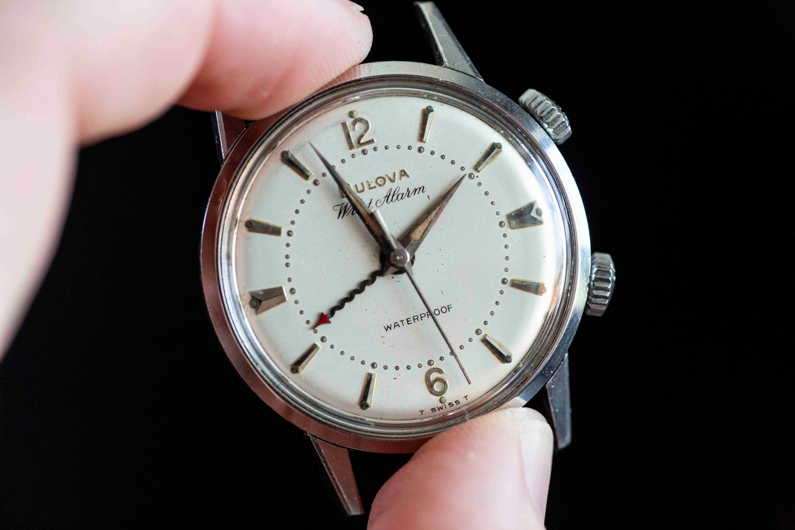 Bulova wrist alarm between fingers