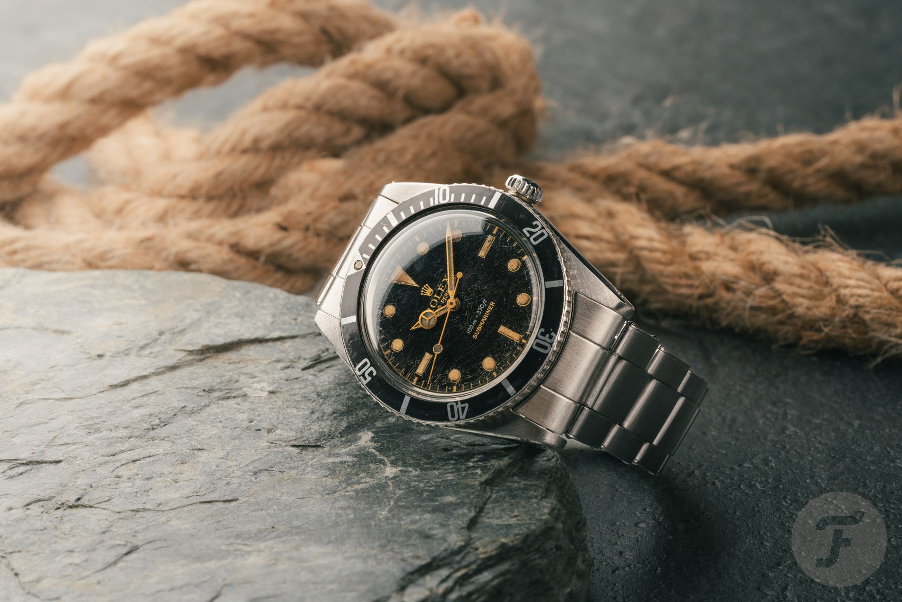 vintage Rolex Submariner ref. 5508 on its side, crown up