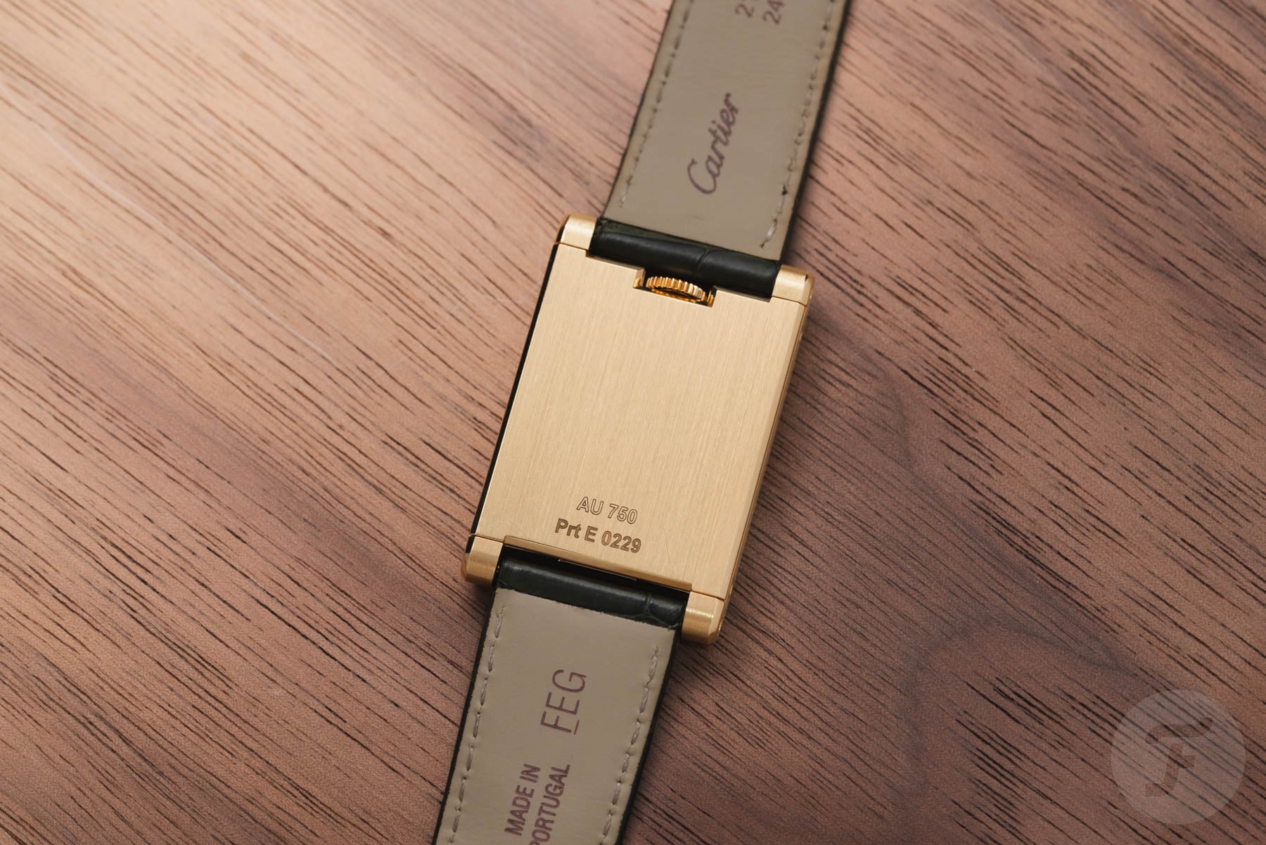 case back of yellow gold Cartier Tank à Guichets