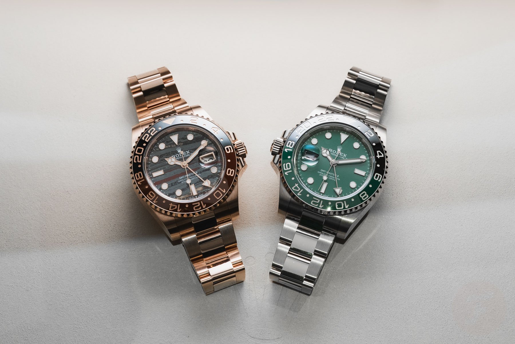white gold Rolex GMT-Master II "Sprite" ref. 126729VTNR next to Everose gold ref. 126715CHNR