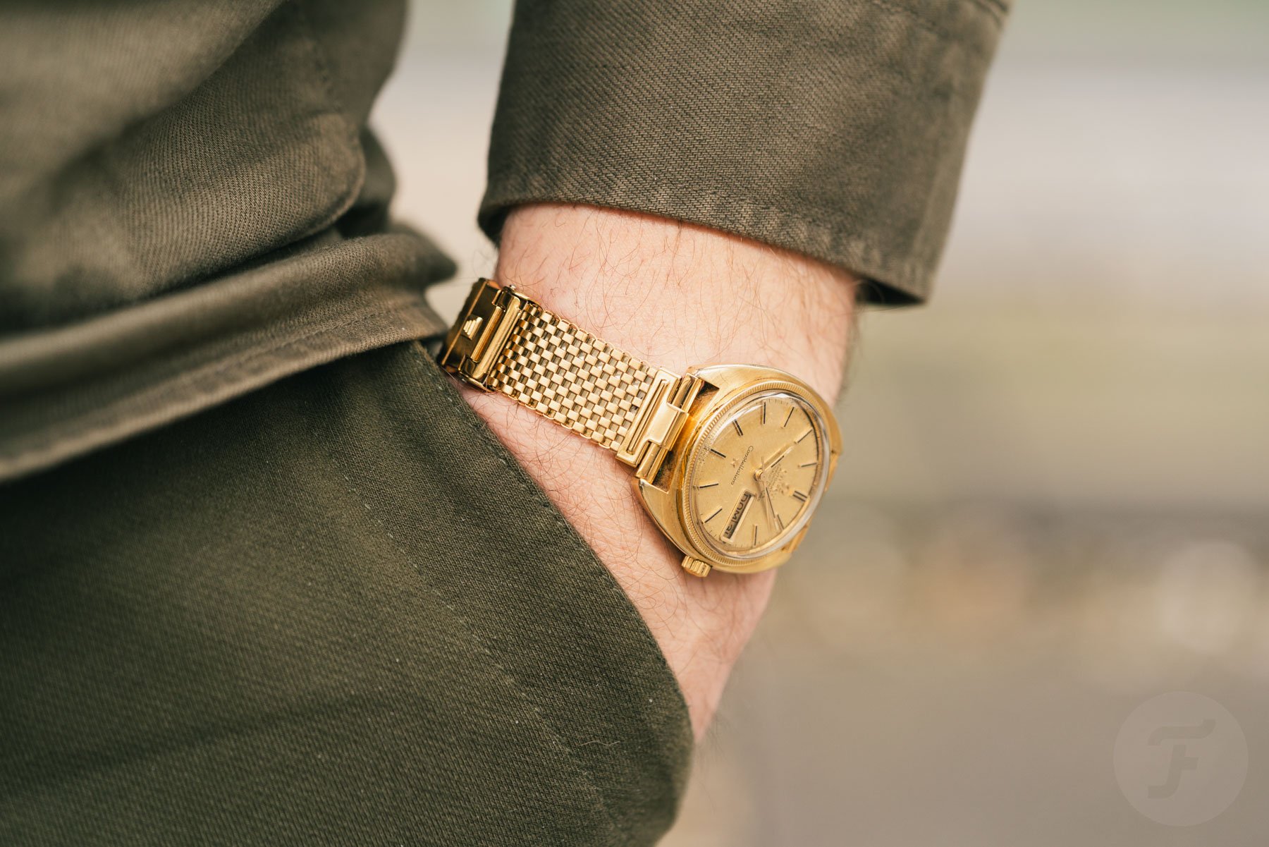 Gold-plated Fourstoner Komfit Mesh Bracelet, Omega Constellation in Pocket Shot