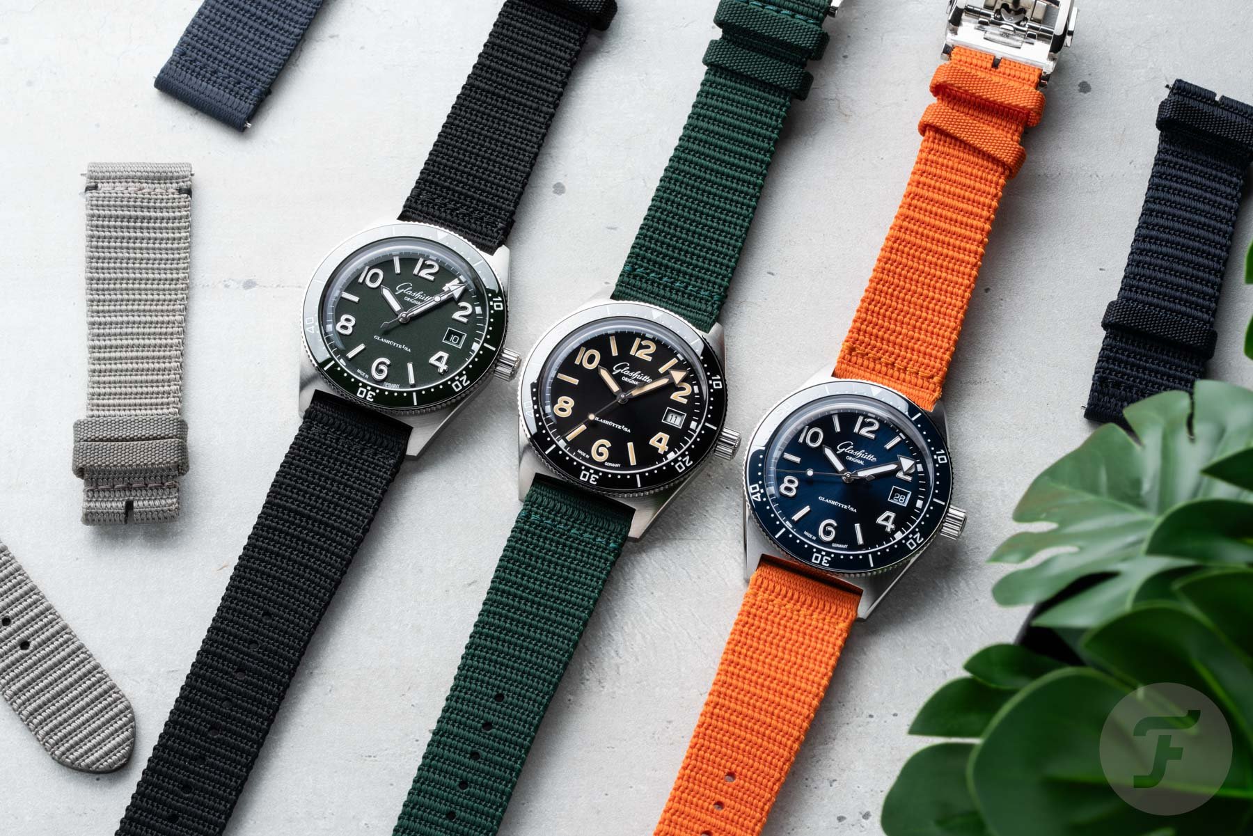 39.5mm Glashütte Original SeaQ models with five textile straps, flat-lay