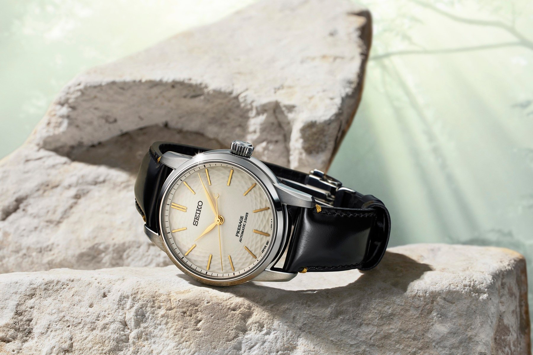 Seiko Presage Classic Series Craftsmanship Unglazed Arita Porcelain Dial Limited Edition SPB497 on rock, crown up