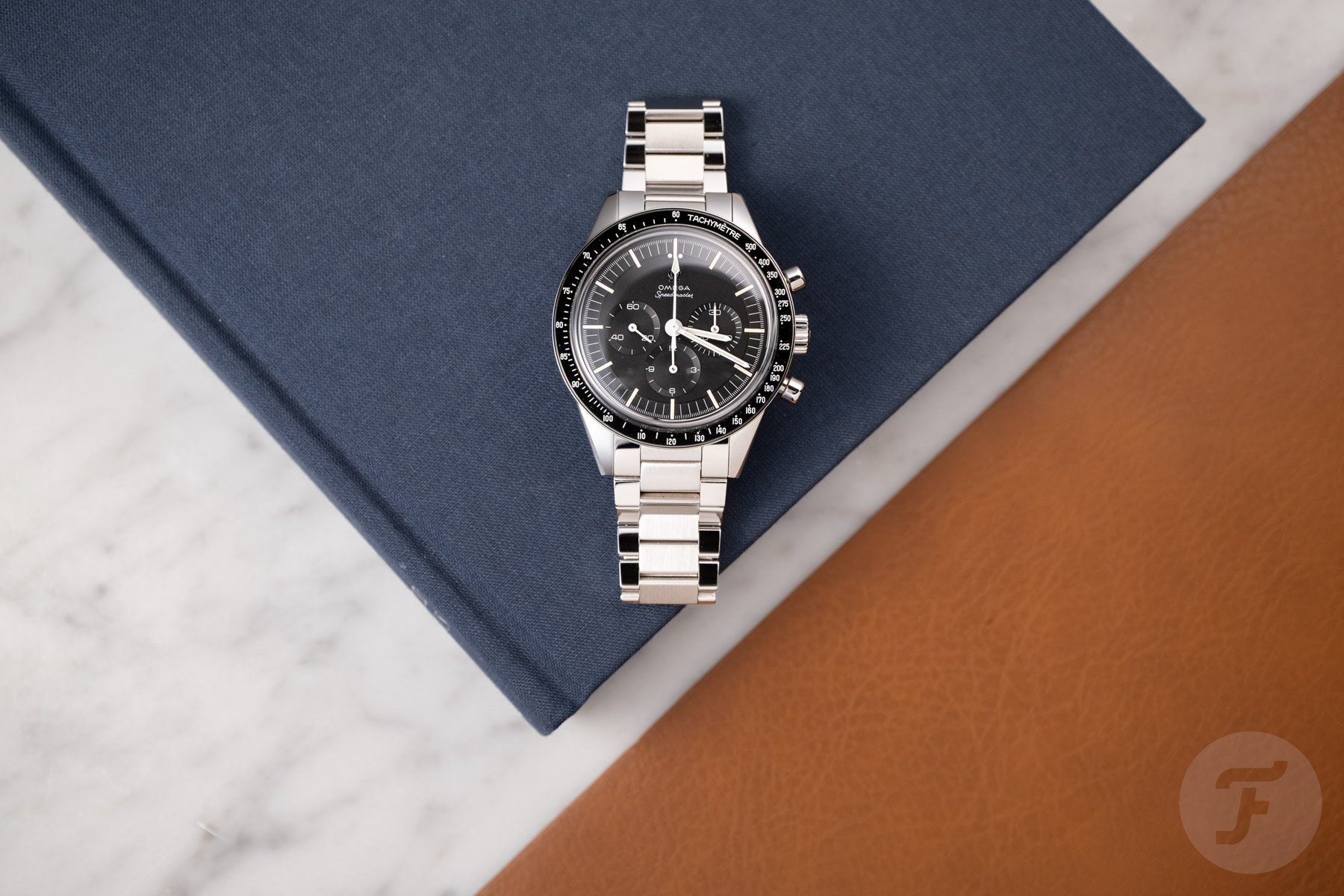 Omega Speedmaster Caliber 321 blig-lay on Book