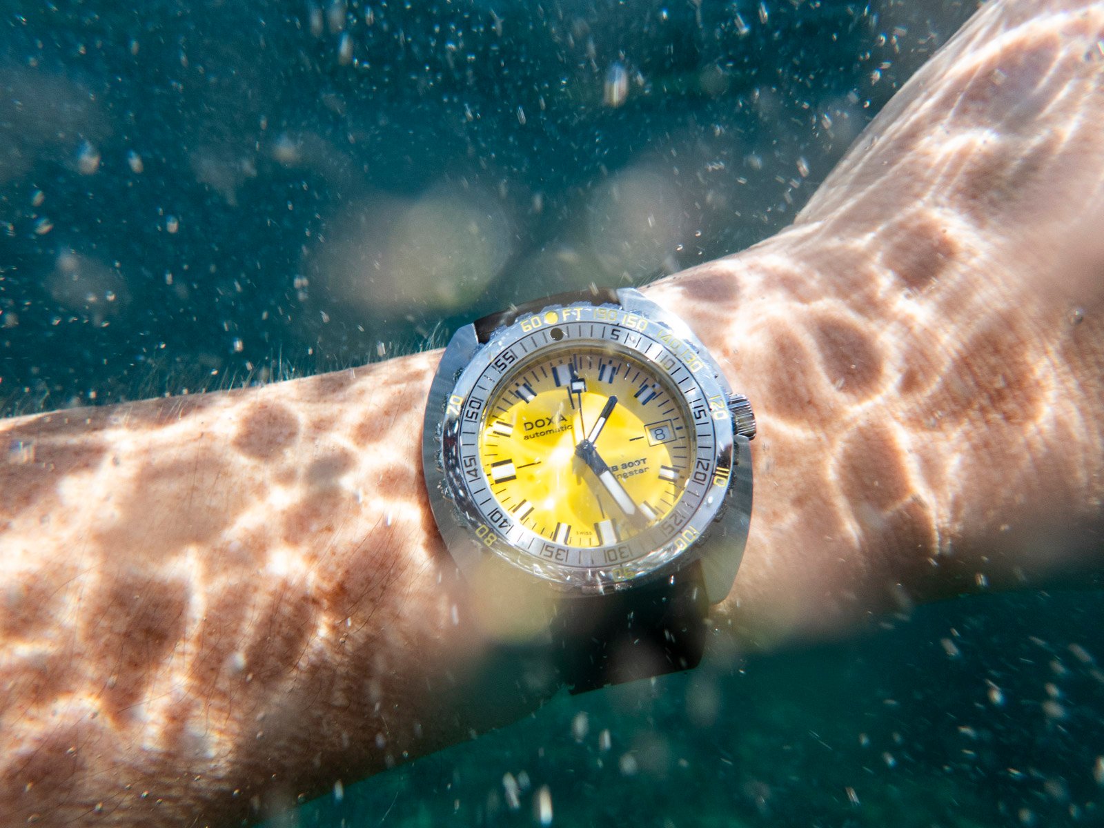 Doxa Sub 300T on wrist underwater