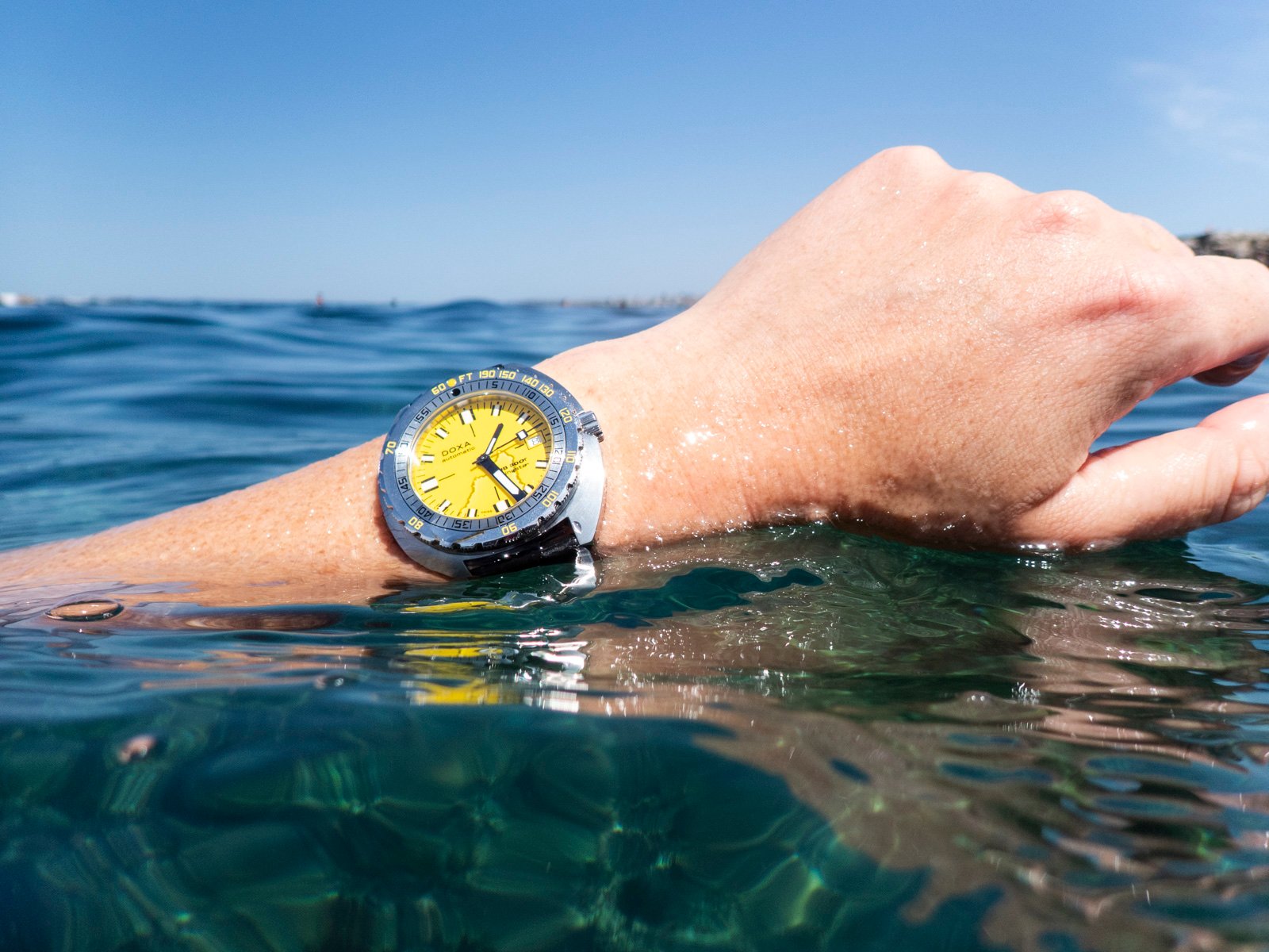 Doxa Sub 300T Divingstar on wrist in water