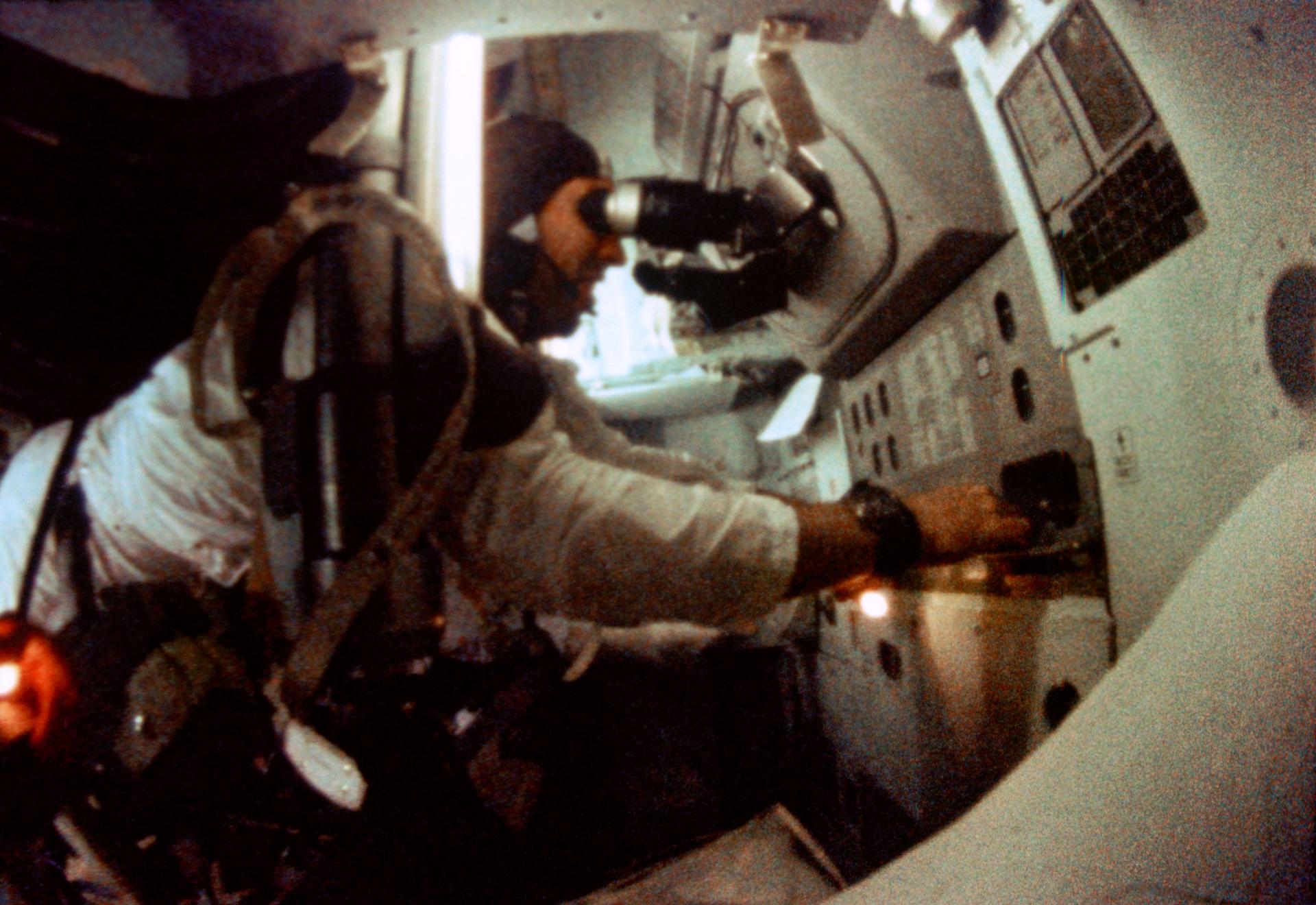 Astronaut James A. Lovell Jr. at the Apollo 8 Spacecraft Command Module's Guidance and Navigation station during the Apollo 8 lunar orbit mission