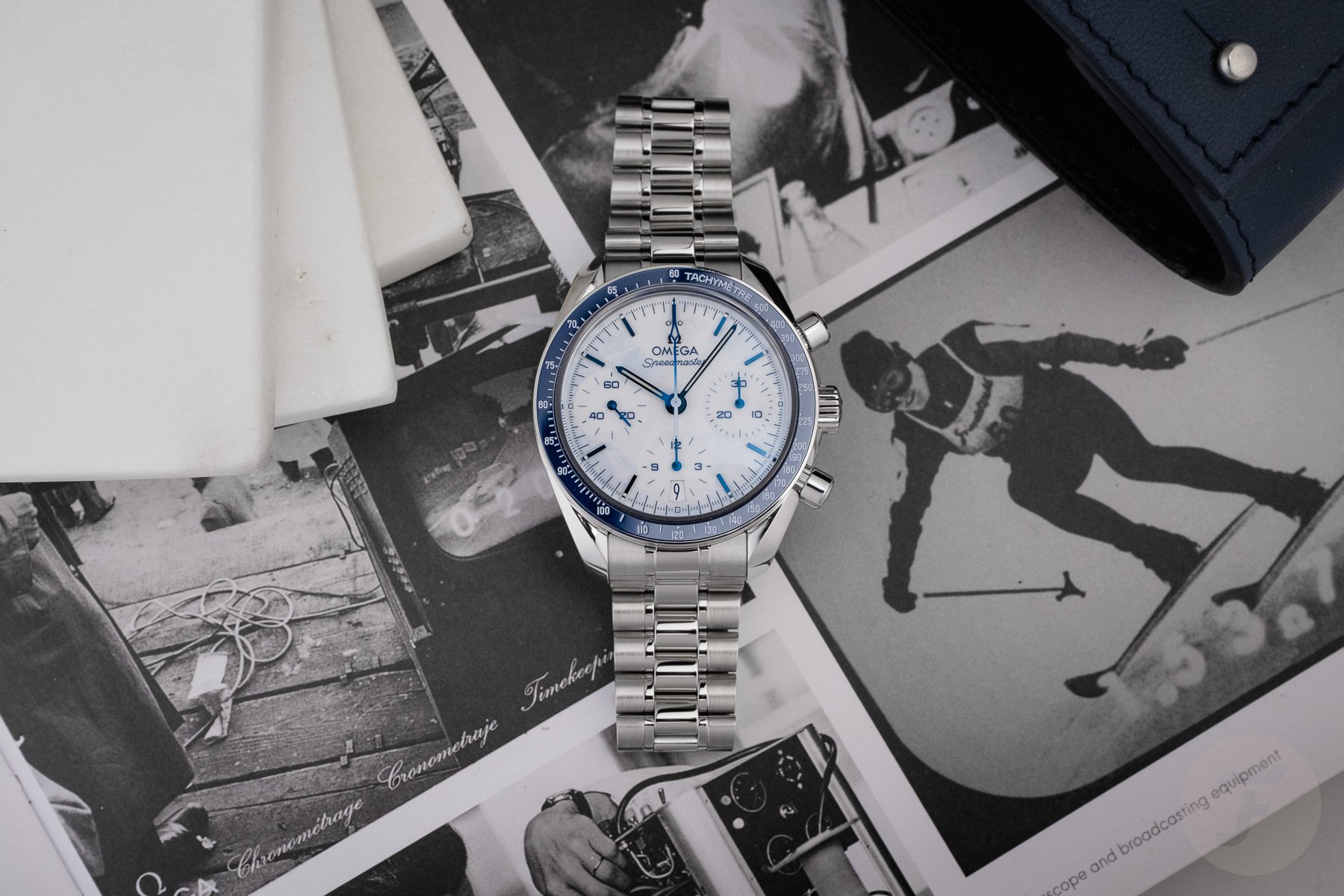 Omega Speedmaster Milano Cortina 2026 flat-lay