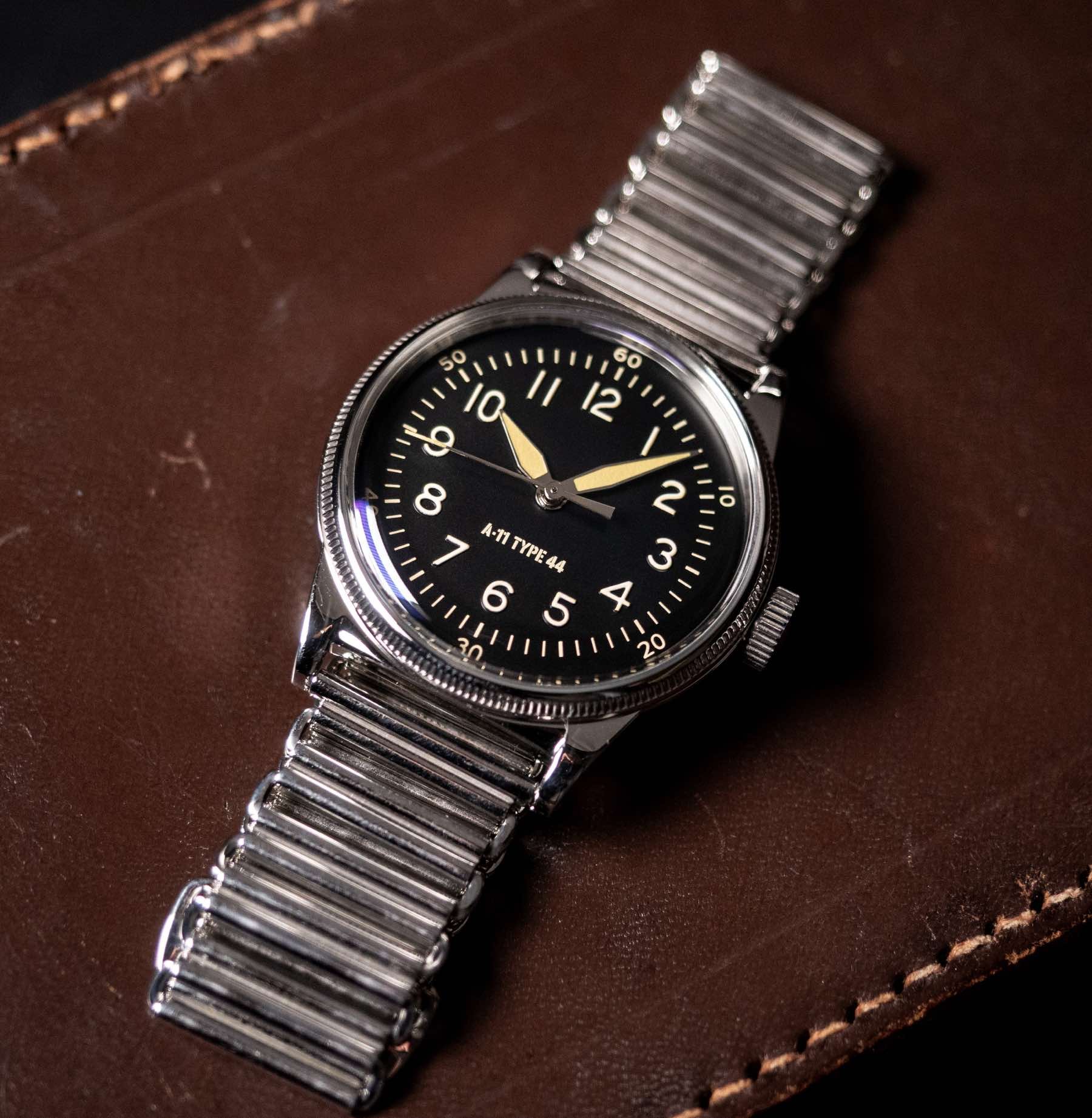 Praesidus × The Watch Observer A-11 Type 44 on Bonklip bracelet, flat-lay