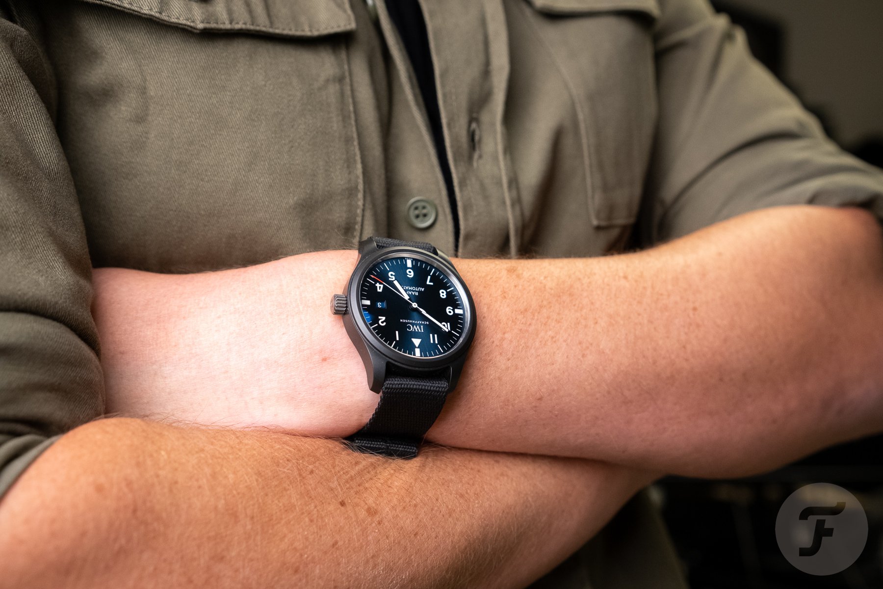 IWC RAAF Pilot's Watch on wrist, arms crossed