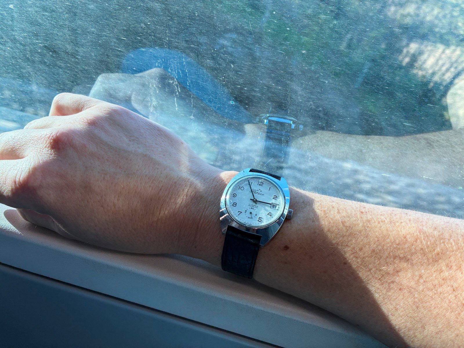 Perseo FS watch wrist shot in front of train window